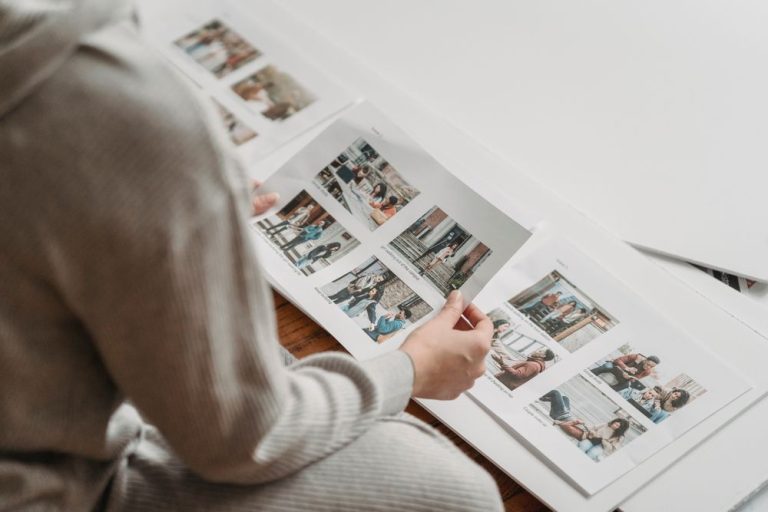 Someone turning the pages of a printed photo album