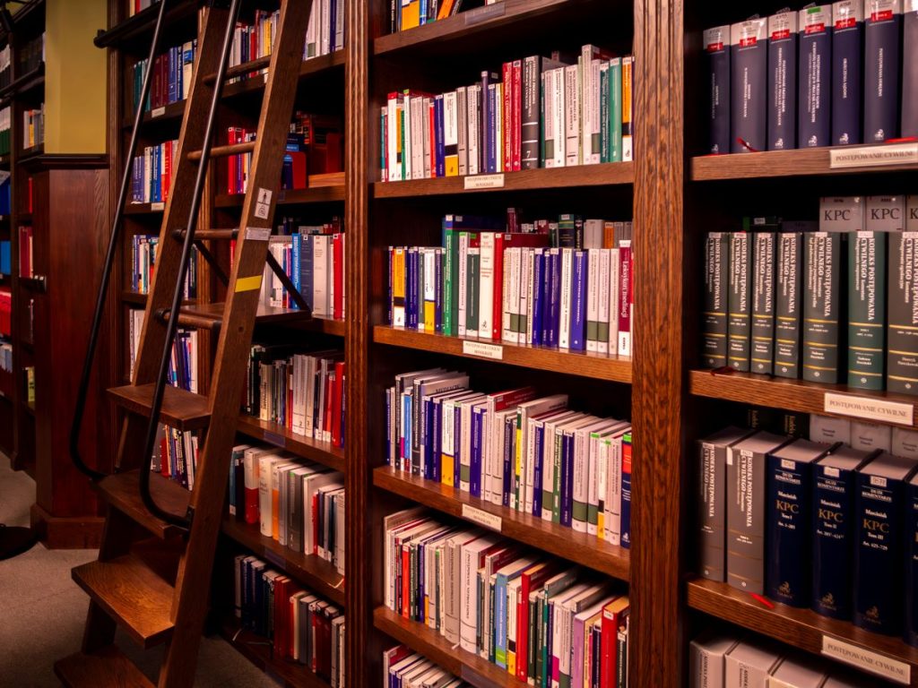 Floor-to-ceiling wooden bookshelves filled with law books
