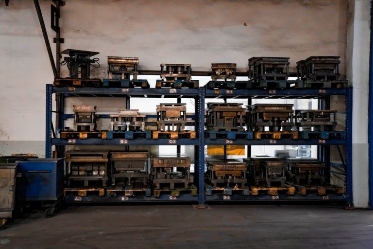 Shelves of machined parts and tools in a workshop