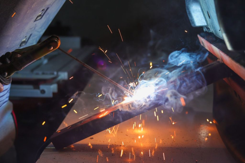 Sparks flying as a metal part is welded