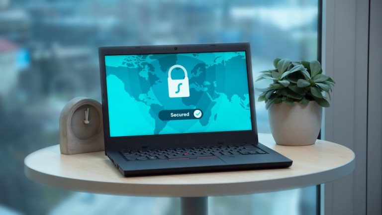 A laptop on a table showing a padlock and a secure connection message