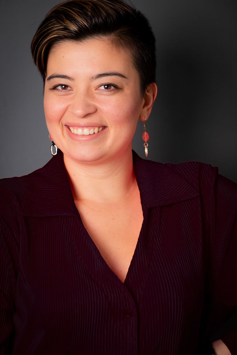 Amara Okafor, Head of Operations, in a studio portrait