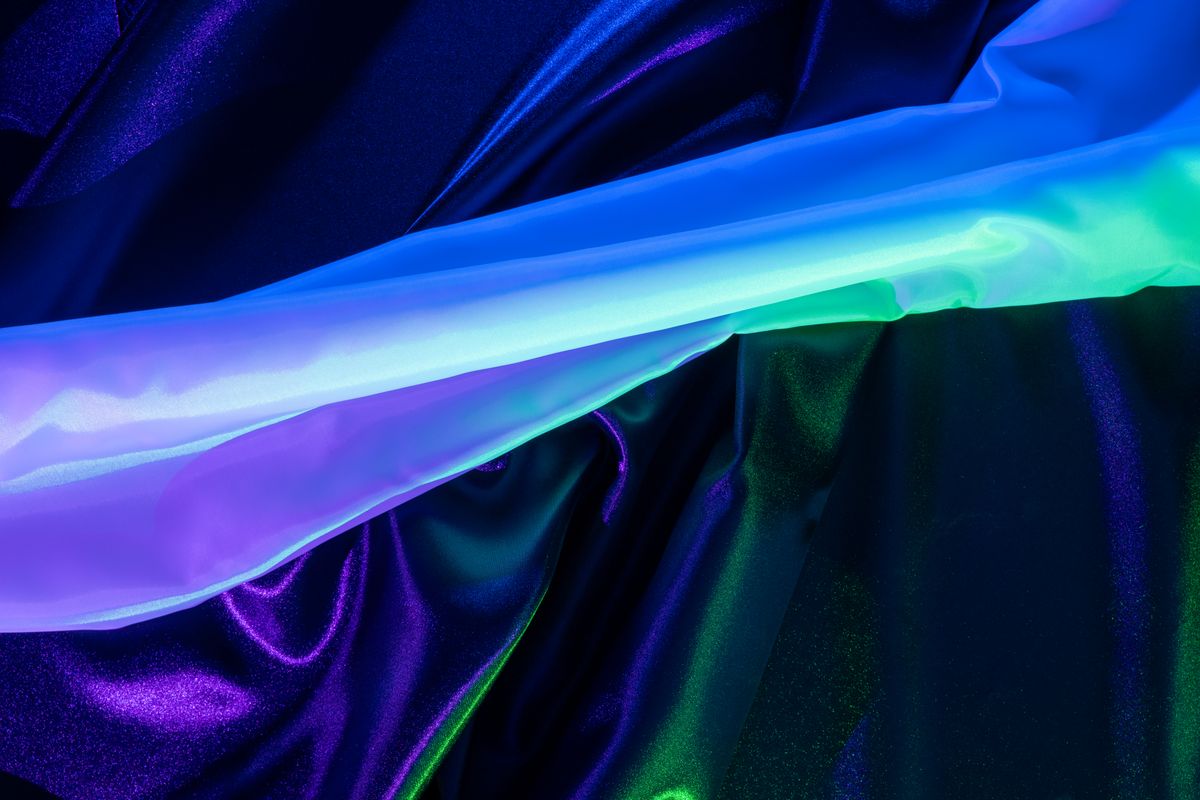 Flowing blue and green satin with a bright highlight