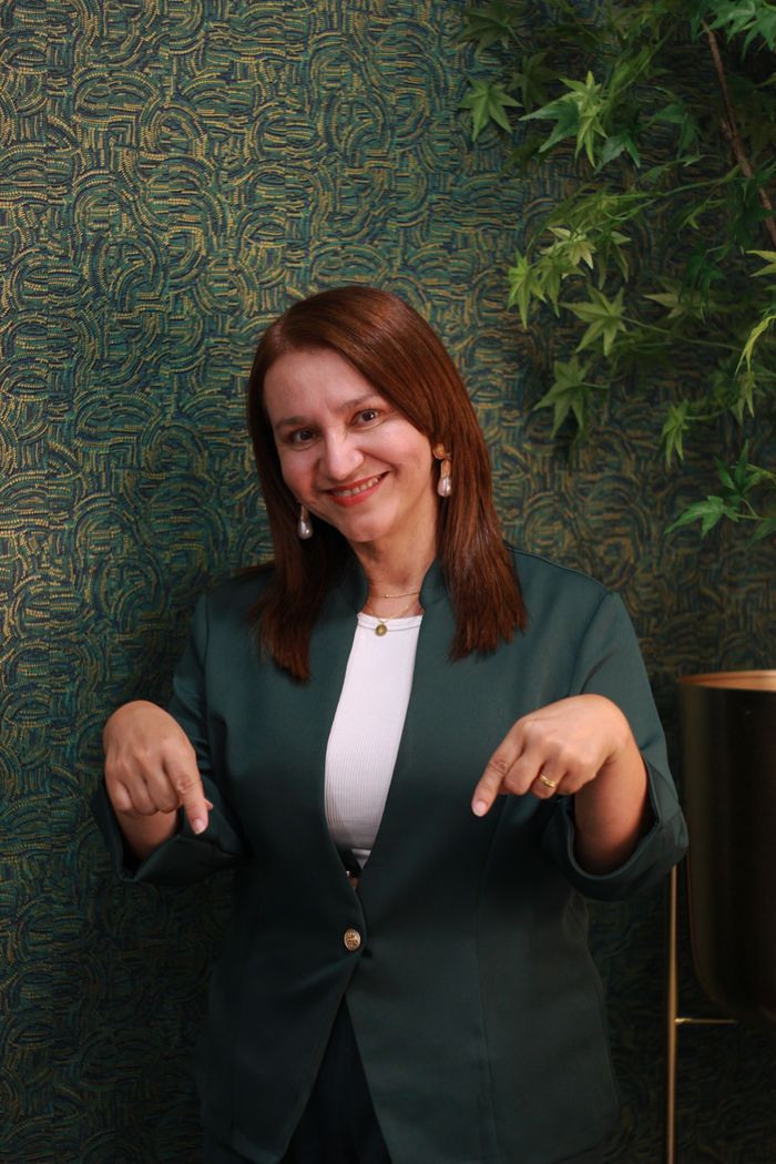 Marta Kowalski, Managing Director, in a green blazer