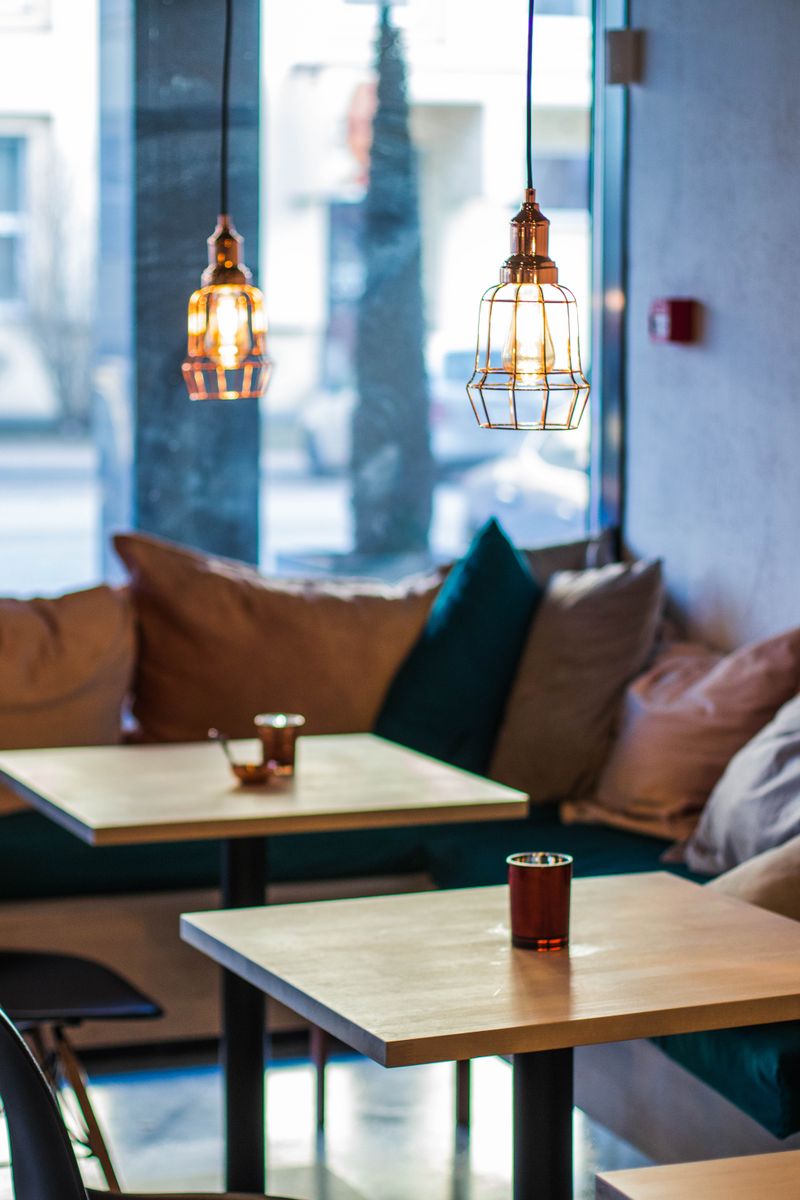 A window corner booth with lantern lights