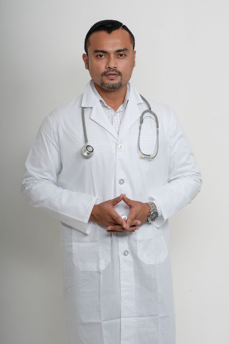 Dr Rahul Menon, Internal Medicine, in a white coat with a stethoscope