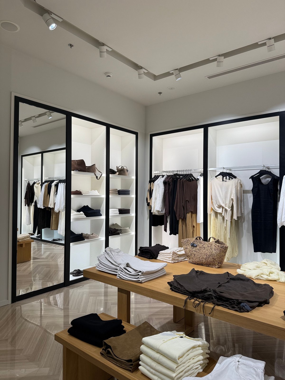 Modern clothing store interior in neutral tones