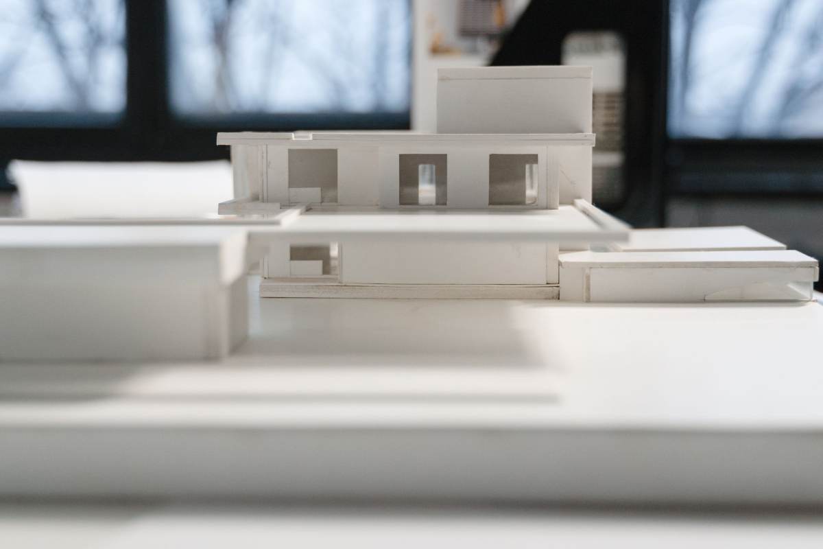 A white cardboard model of a house