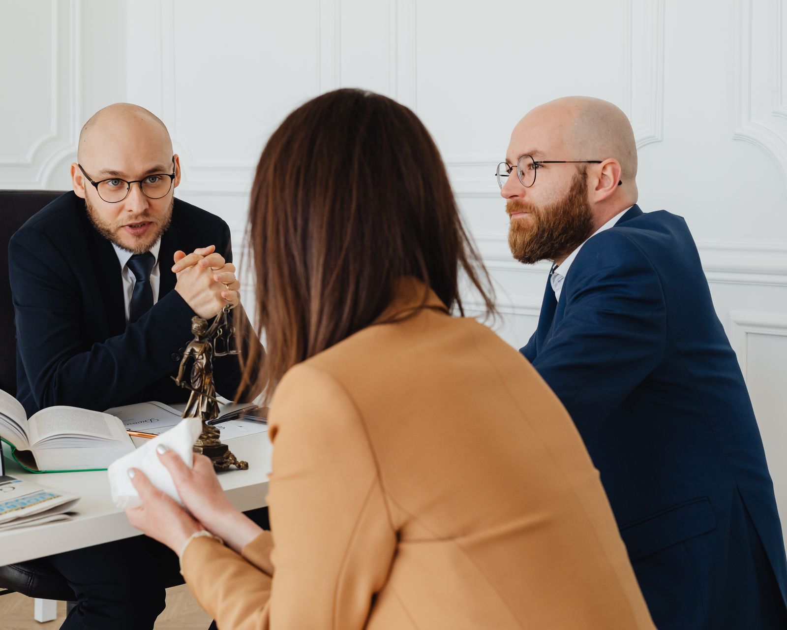 Attorney consulting with a client in a law office