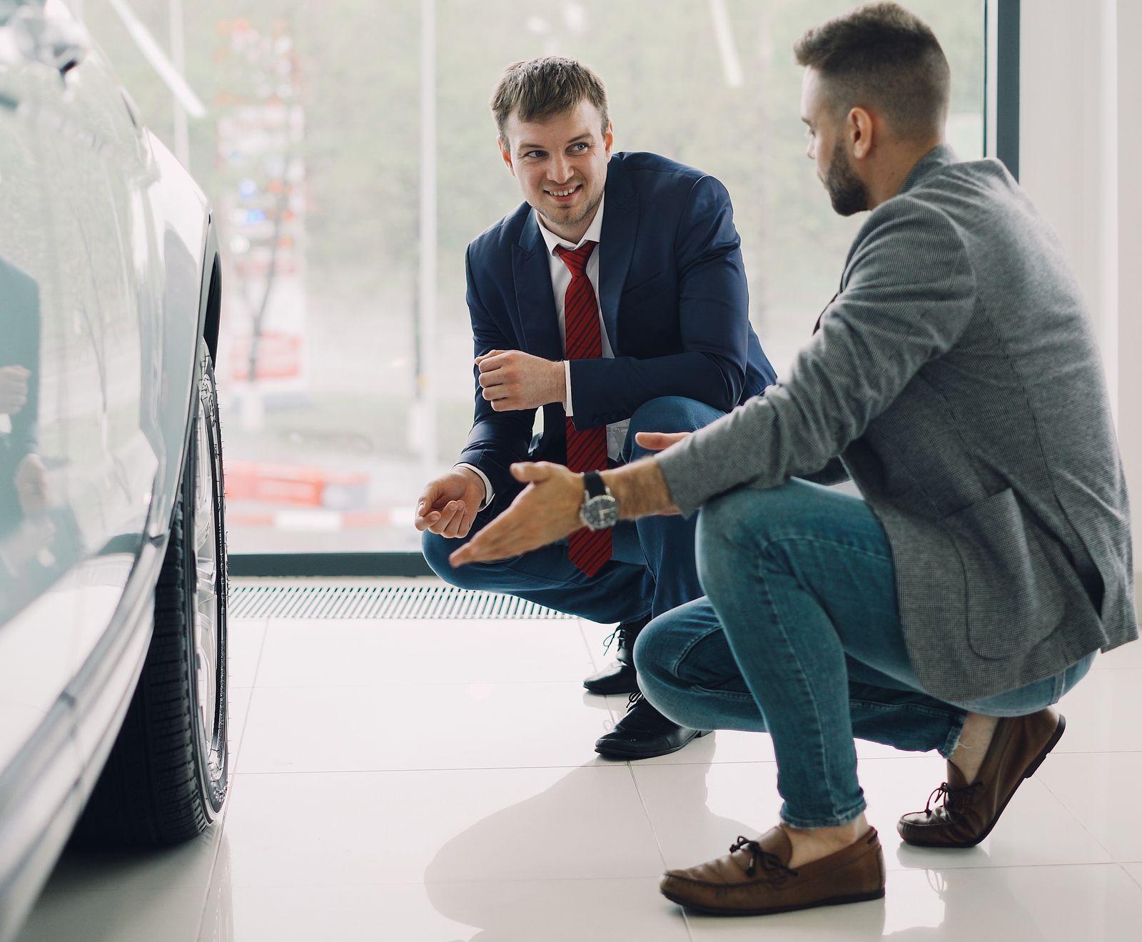 Sales advisor discussing a vehicle with a customer in the showroom