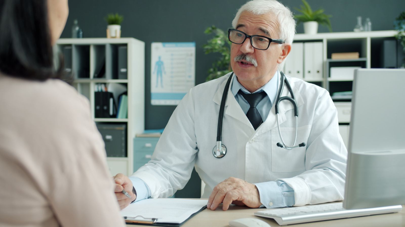 Doctor consulting with a patient in a clinic office